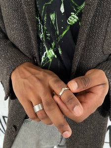 A simple ring resembling the V-shape of the wave crest.   Highlight your outfit with the statement piece. Elevate your style with our minimalist ring, perfect for daily wear and layering. Crafted from high-quality stainless steel and available in silver color.   Material: Surgical steel, Color: Silver | water-resistant, no-tarnishing, hypoallergenic |