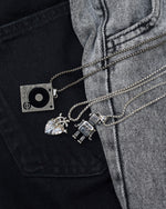 Load image into Gallery viewer, Play despacito.  Minimalist necklace featuring delicately designed robot pendants. Elevate your style with our necklace, perfect for daily wear and layering. Crafted from high-quality titanium and available in silver color.   Material: Titanium. 60+5cm in length.  | waterproof, no-tarnishing, hypoallergenic |
